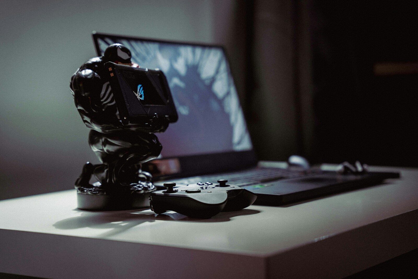 a toy action figure on a laptop