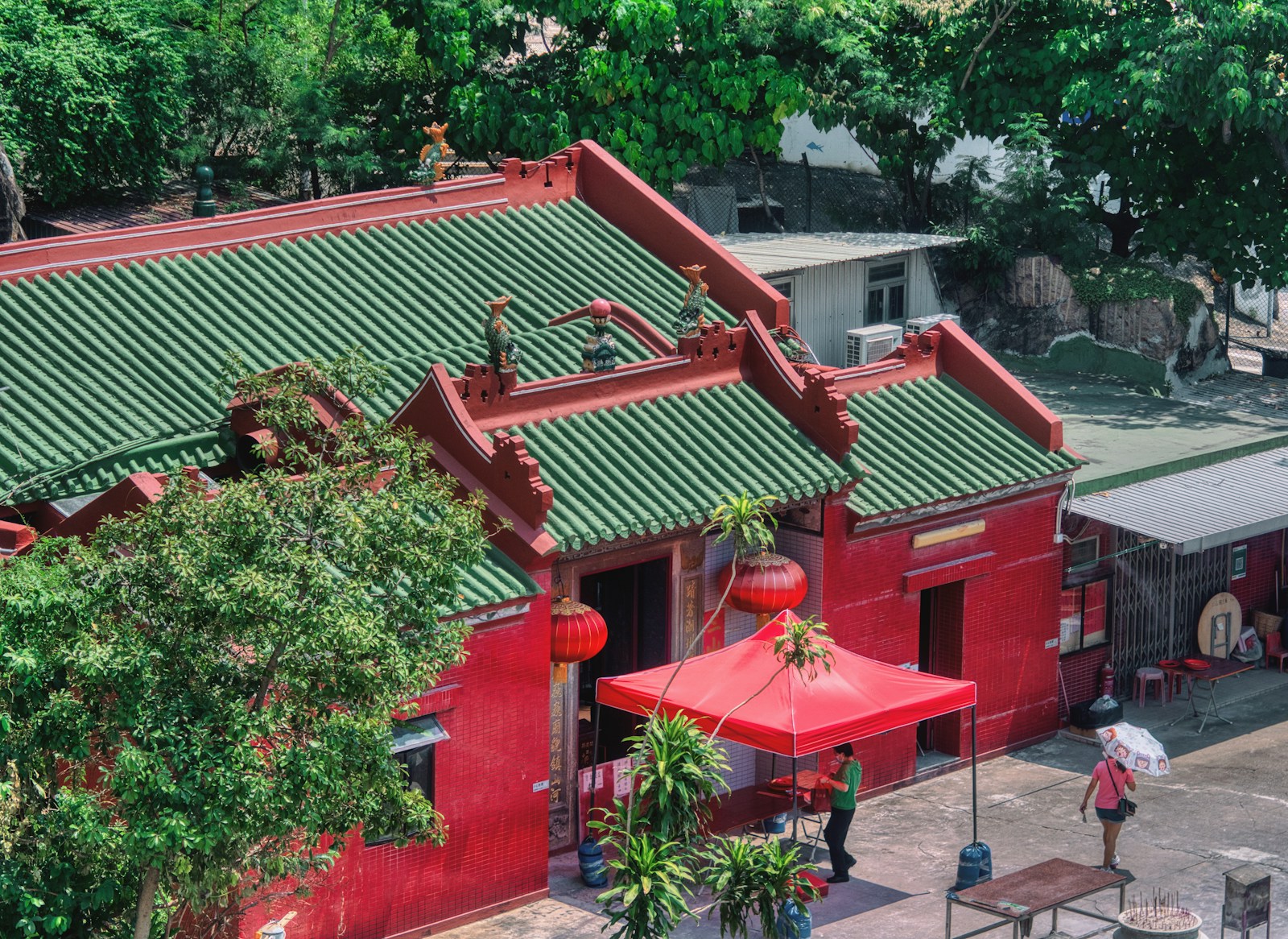 a red building with a red umbrella